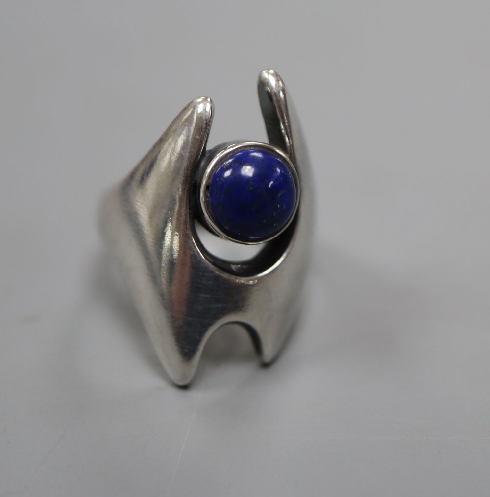 A post 1945 Georg Jensen sterling and cabochon lapis lazuli dress ring, design no. 139, size O, gross 9 grams.